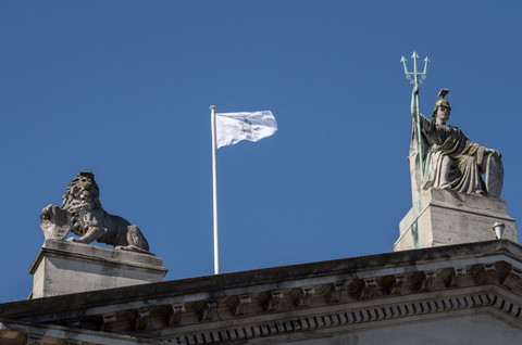The Future is Fragile flag by Agnes Denes waving above Tate Britain